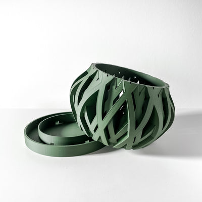 3D printed orchid pot with sculptural airflow design in green, modern geometric planter for orchids and small indoor plants.