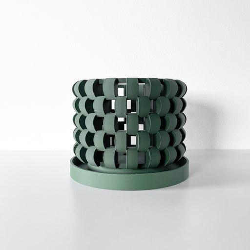 Geometric 3D printed orchid pot in green, ideal for vertical garden or home office decor