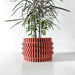 Short cylindrical flower pot with undulating ridge design and flat rim, wavy-textured planter printed with dimensional horizontal bands