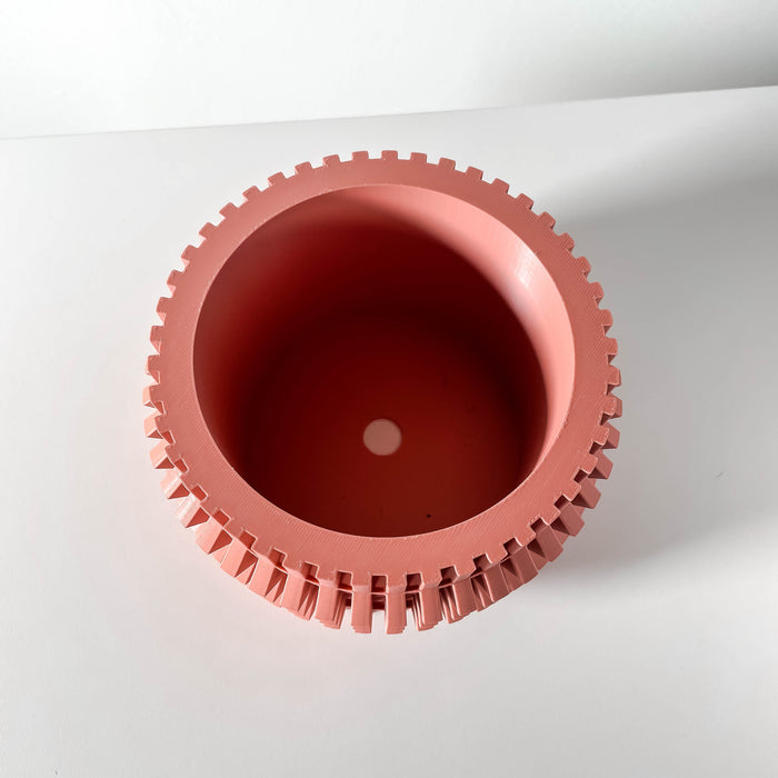 Top-down view of 3D printed pot with visible circular opening and wavy wall structure, red planter with crisp edge and patterned rim