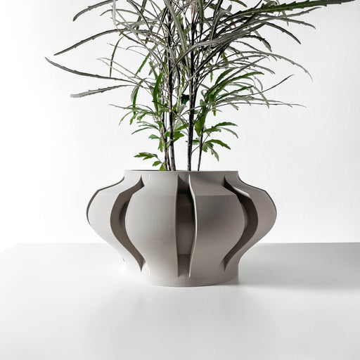 Sculptural 3D printed planter with wide base and pinched hourglass shape, decorative pot with vertical wave indentations and curved profile