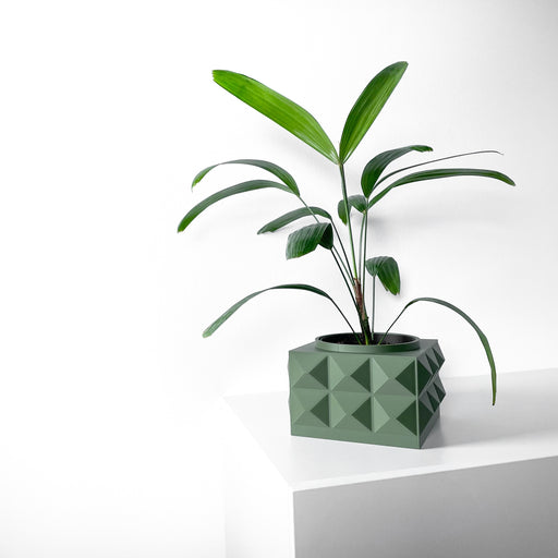 Light green 3D printed planter pot with compact square base and evenly distributed pyramidal spikes covering all sides