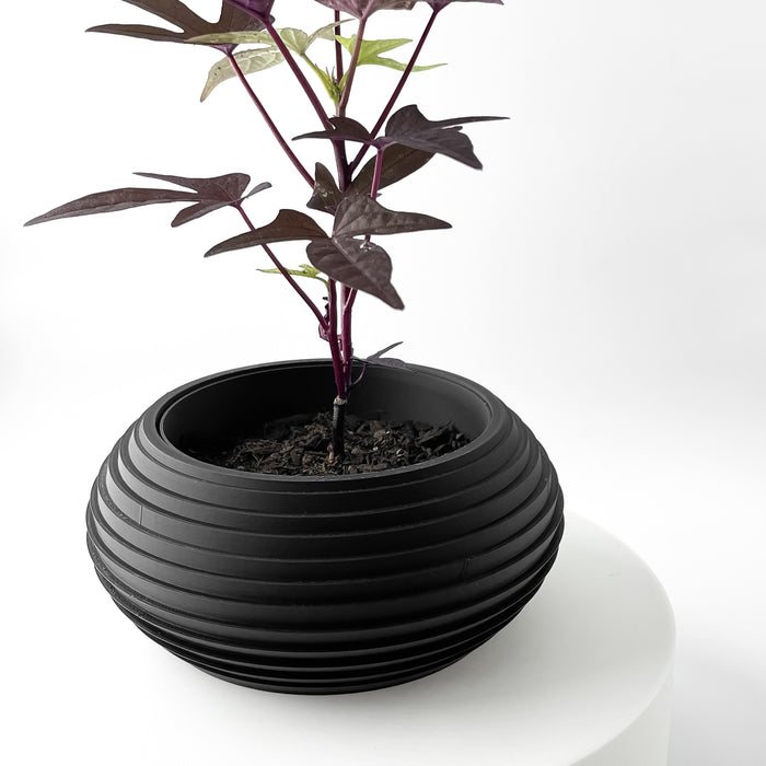 Top-down view of ribbed decorative planter, showcasing round opening and smooth rim