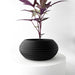 Low-profile 3D printed planter with wide oval shape and horizontal ribbed surface, modern tabletop pot