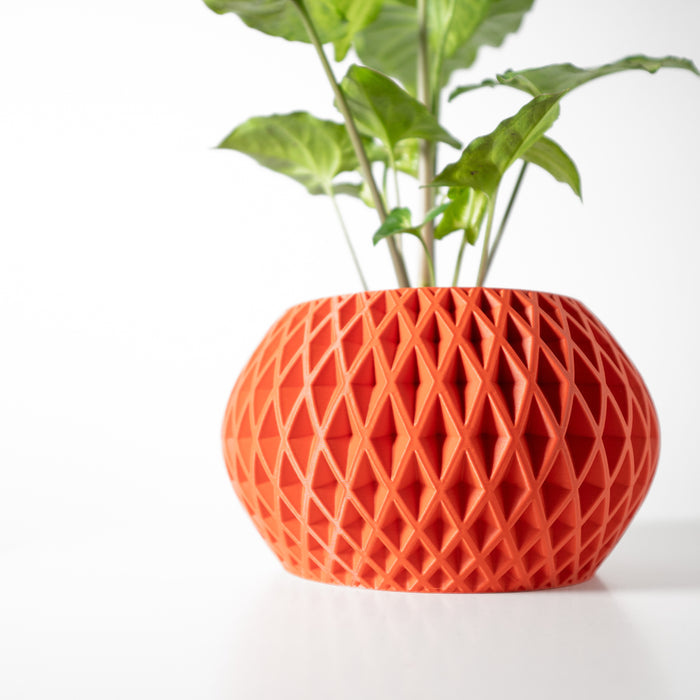 Designer pot featuring geometric surface pattern and bulbous form, ideal for contemporary plant decor
