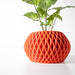 Designer pot featuring geometric surface pattern and bulbous form, ideal for contemporary plant decor