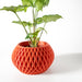 Compact tabletop plant pot with sculptural faceted walls and smooth symmetrical curves