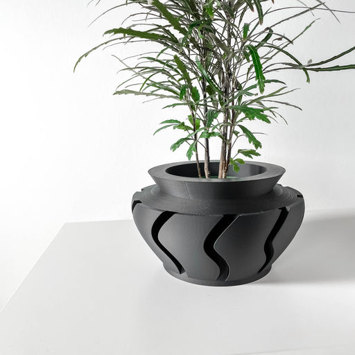Futuristic 3D printed sculptural planter with curved cutout base, rounded modern flower pot for bold home decor
