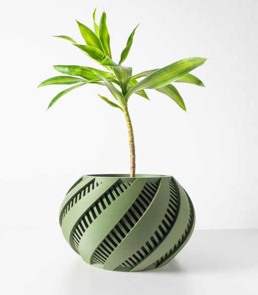 Modern 3D printed planter with diagonal spiral grooves and rounded form, sculptural pot for decorative plant display