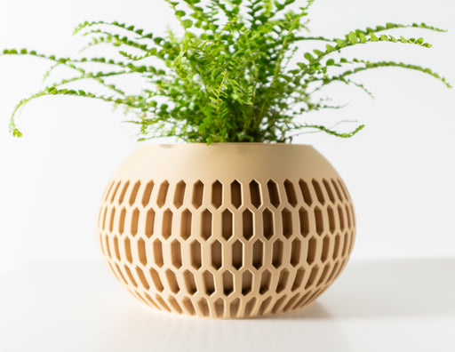 Modern 3D printed planter with hollow lattice structure and cylindrical silhouette, unique decorative pot for contemporary indoor plants