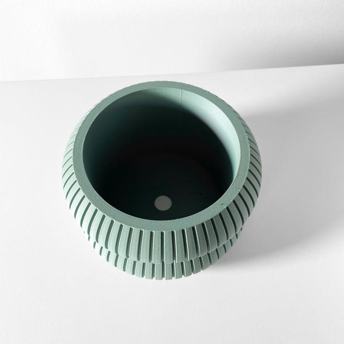 Top view of wide 3D printed flower pot with circular opening and layered ridges, ideal for modern plant lovers and futuristic home decor