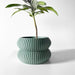 Stylish 3D printed planter pot with curved silhouette and ripple-like surface texture, geometric flower pot for indoor decor and small plants