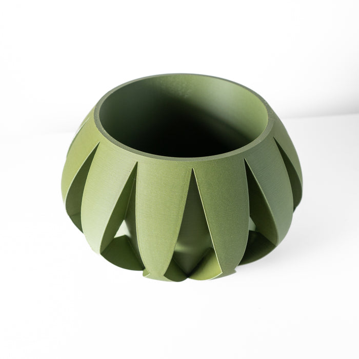 3D printed designer planter with defined flare contours and central opening, resting on flat base with matte layered finish
