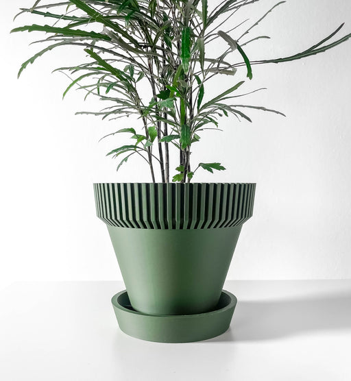 Tall 3D printed planter with vertical fins and flared rim, sculptural plant pot featuring layered cylindrical body and sleek silhouette