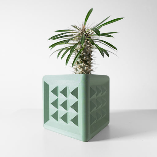 Square 3D printed planter pot in pastel green with repeating raised triangle pattern on front-facing surface
