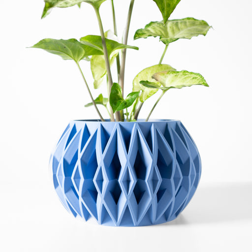 Blue 3D printed planter pot with vertically aligned diamond-shaped texture and round belly form, showcasing layered surface detail