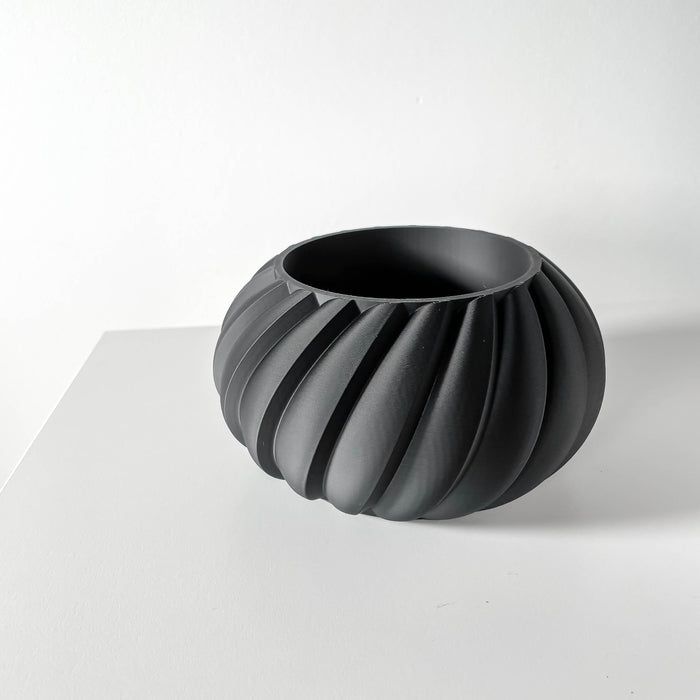 Contemporary ribbed pot with curved petal-like folds, ideal for modern home decor and sculptural plant displays