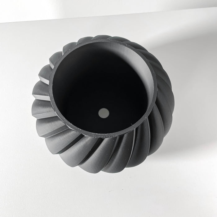 3D printed textured planter in black, designed with architectural waves for a statement plant pot