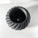 3D printed textured planter in black, designed with architectural waves for a statement plant pot
