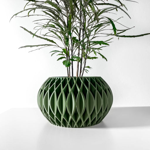 Modern 3D printed planter with oval silhouette and repeating diamond-shaped lattice cutouts, faceted sculptural pot with smooth circular opening