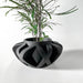Artistic flower pot with flowing geometric curves and airy cutouts, stylish tabletop planter for contemporary home décor