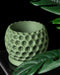Close-up of 3D printed sculptural plant pot with bold pattern, designer home accessory
