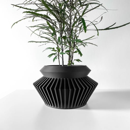 Black 3D printed planter pot with sharp-edged geometric top, wide rounded body, and matte layered texture