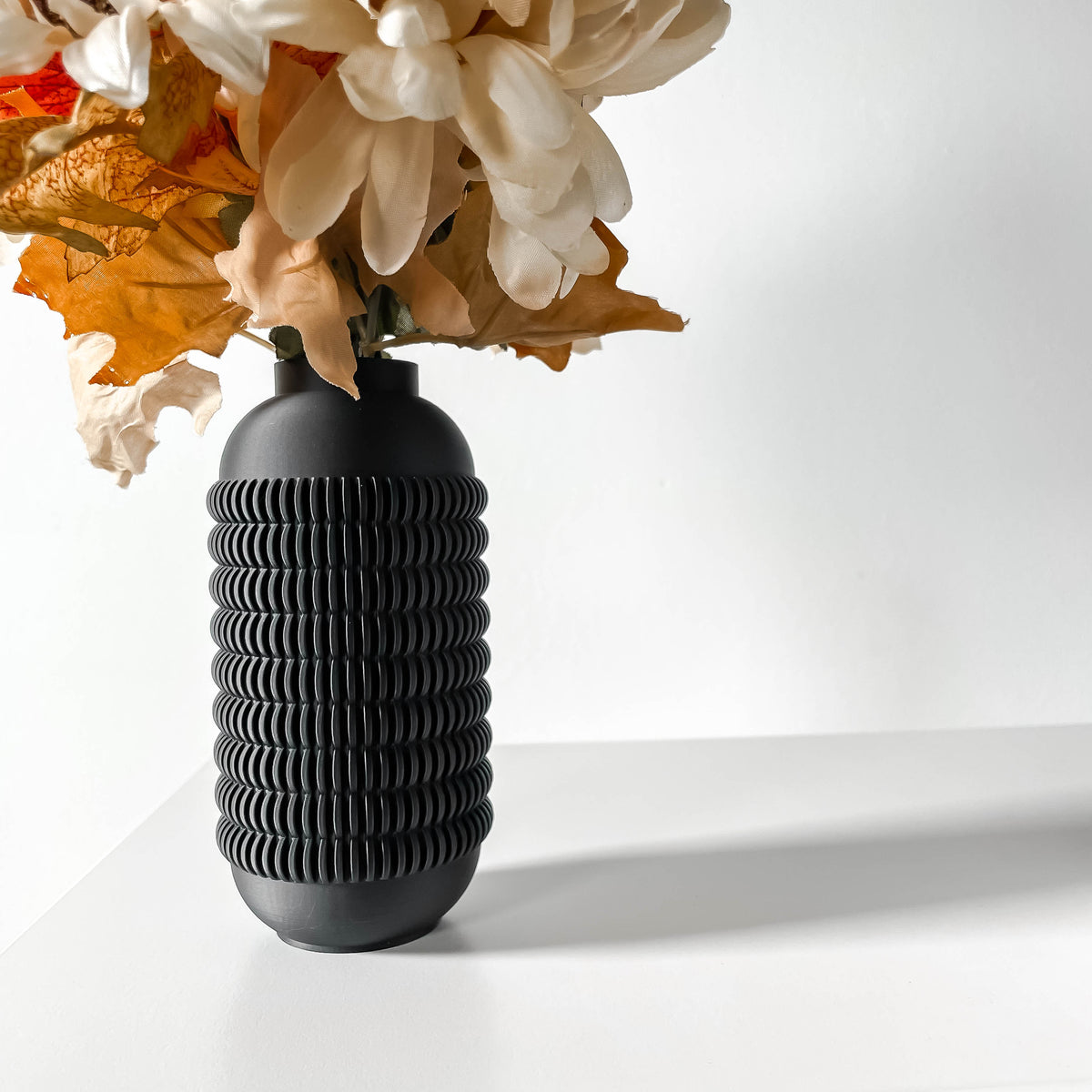 Juny modern textured vase for flowers in black, front view