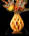 Von sculptural openwork vase with flowers, product view