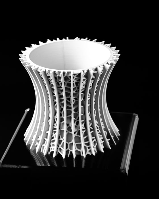 Vora architectural lattice planter showing smooth inner vessel, angled view