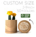 3D printed planter pot with elegant vertical ridges and a diagonal spiral band, featuring bright yellow cactus plants. This unique planter pot is a stylish option for indoor planters, making it perfect as gifts for mom or any plant lover. Ideal for succulents or flowers, this ornate flower pot fits well in any home setting and functions beautifully as a low planter pot or book plant pot for shelves or desks.