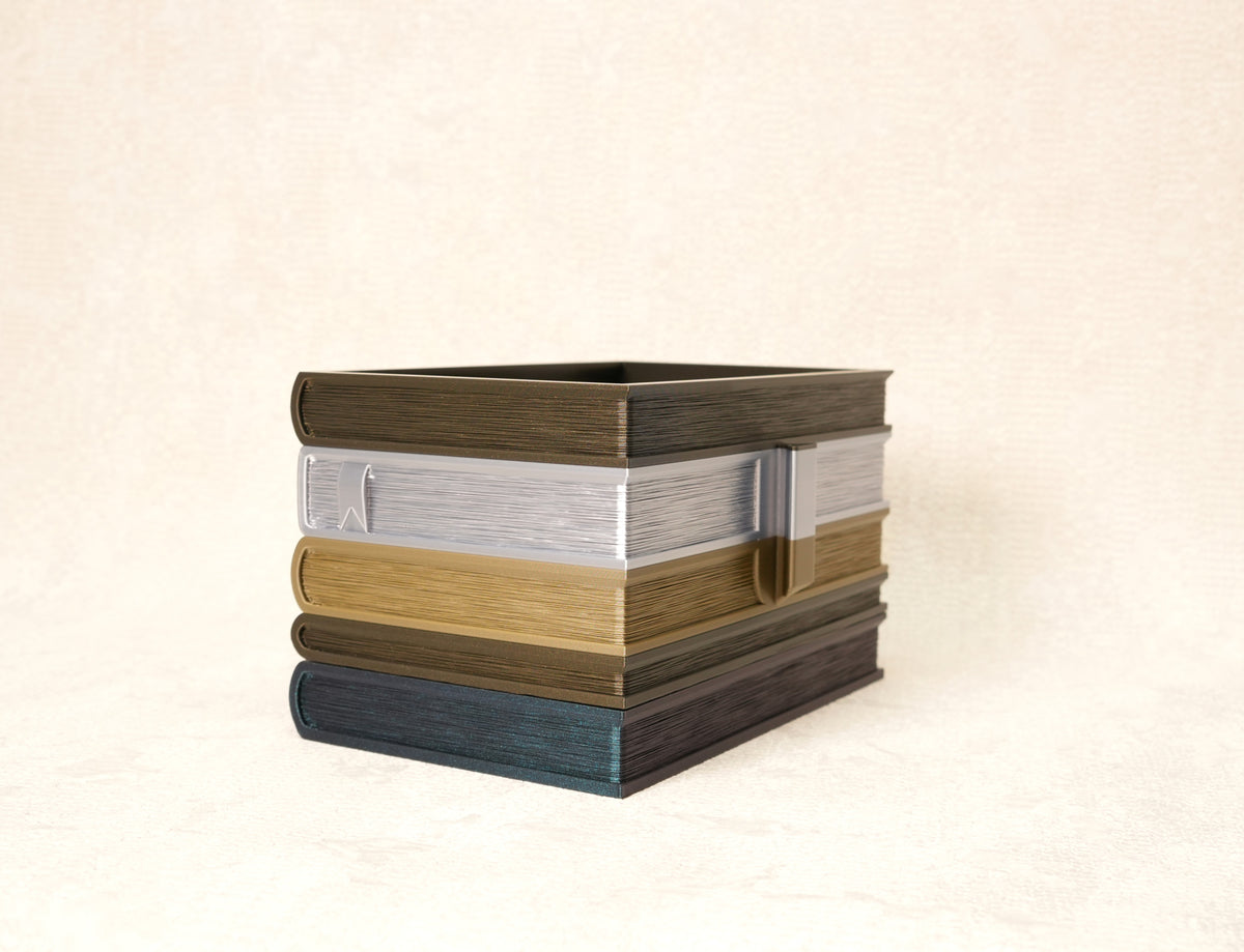 Front view of the multicolor book flower pot "Orven" without a plant