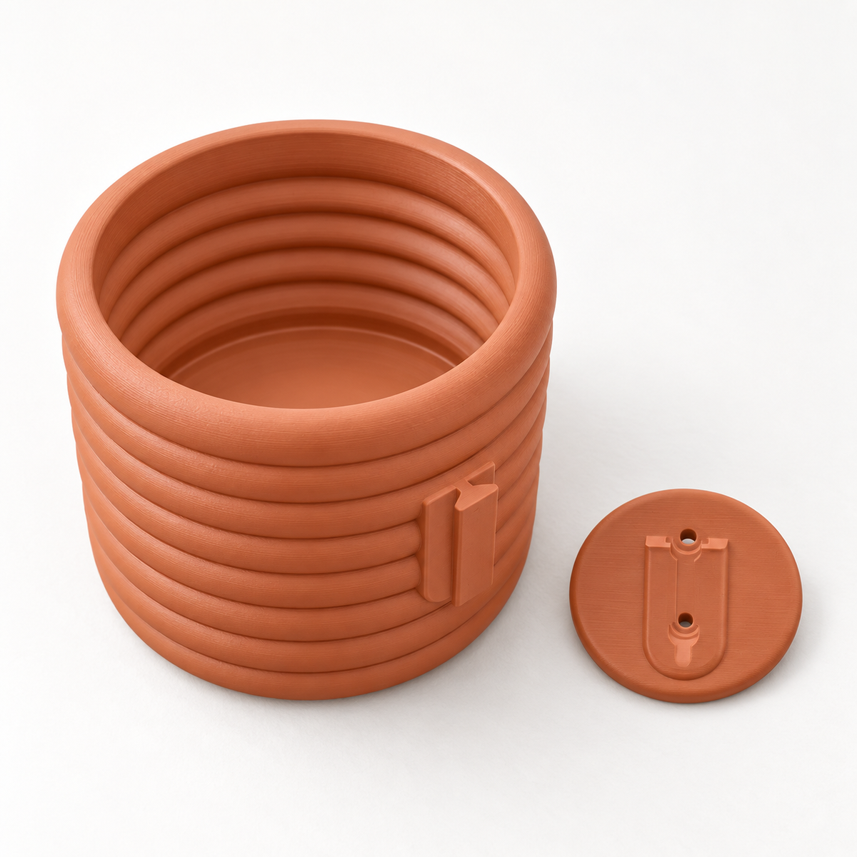 Rear and top view of the Rilo planter showing its mounting fitting beside the separate wall bracket.