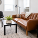 Ivory Zipra planter with fern on a coffee table in a living room; styled example