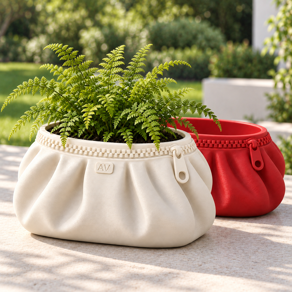 Ivory Large ASA Zipra pouch planter with fern in front of red Medium planter on an outdoor patio; one planter per order